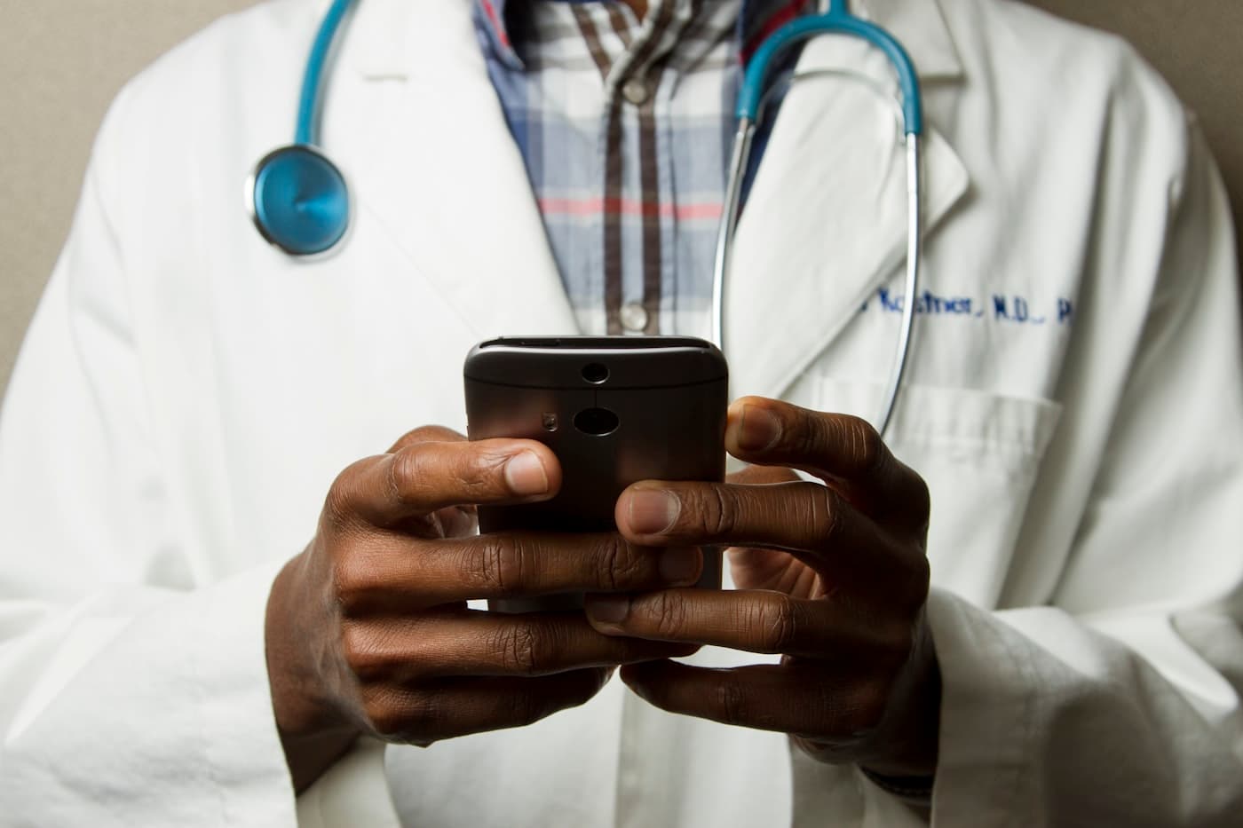 Healthcare professional using a digital patient management system